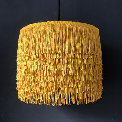 Gold tassel lampshade with Cole & Son liner