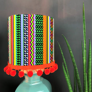 Multi-stripe fabric with mirror copper liner and optional orange pompom lampshade